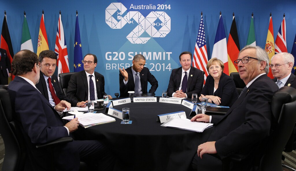 U.S. President Barack Obama (C) gestures as he meets with European leaders to discuss the situation in Ukraine, at the G20 in Brisbane November 16, 2014. Pictures are (L-R) Spanish Prime Minister Mariano Rajoy, Italian Prime Minister Matteo Renzi, French President Francois Hollande, Obama, British Prime Minister David Cameron, German Chancellor Angela Merkel, European Council President Herman Van Rompuy and European Commission President Jean-Claude Juncker.