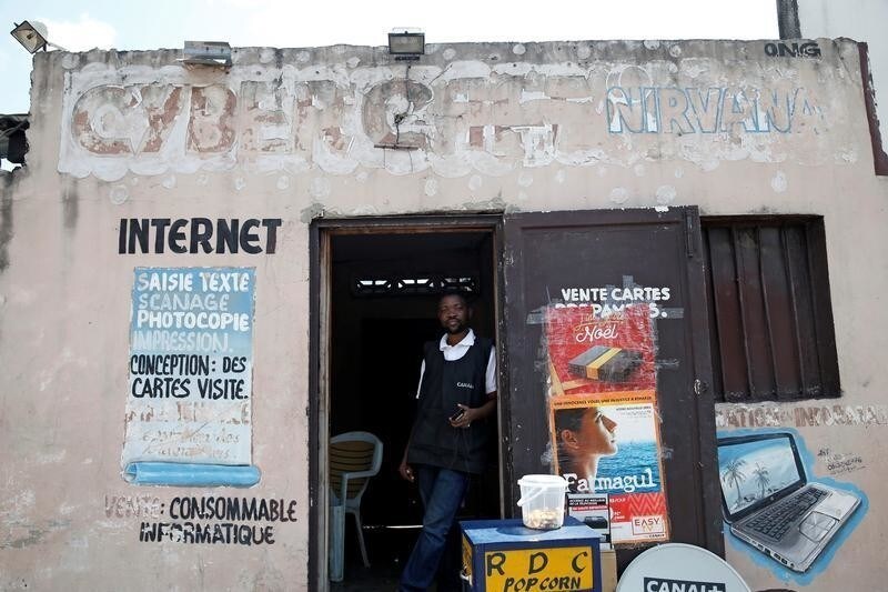 Congolese internet cafe owner Theo stands at the entrance of his empty business in Kinshasa, Democratic Republic of Congo, January 7, 2019. REUTERS/Baz Ratner - RC17DFF85060