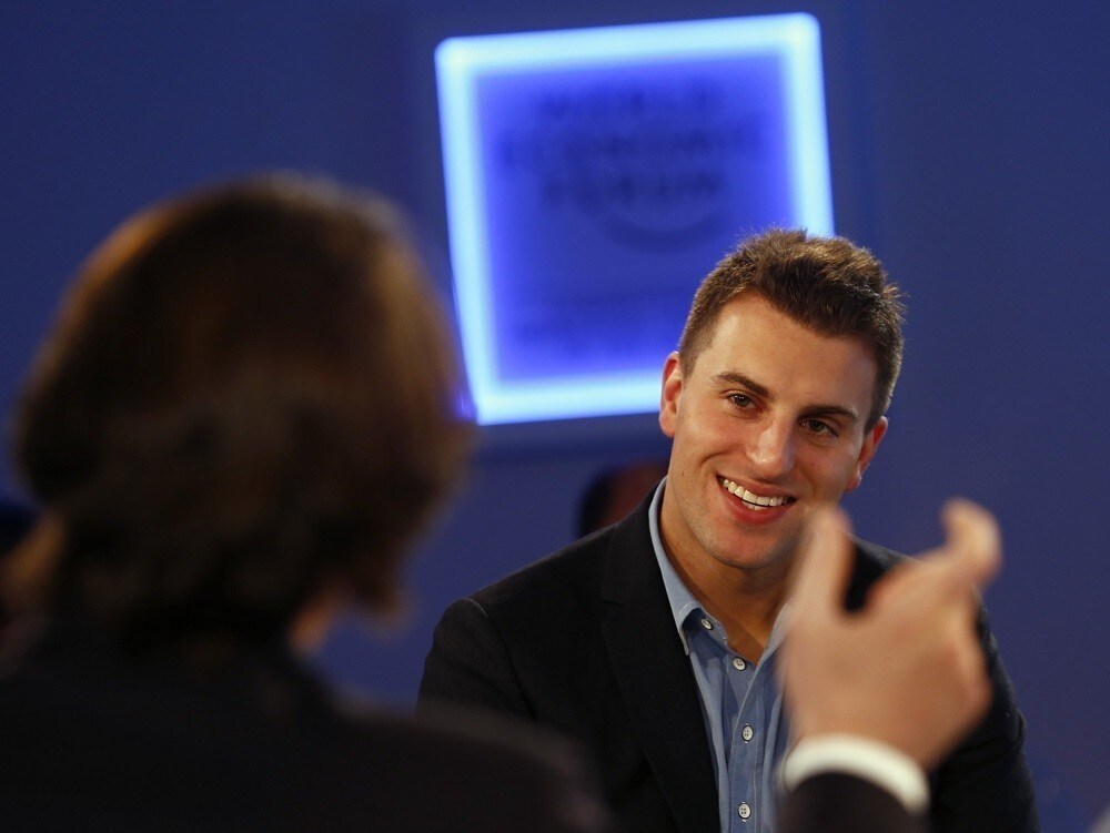 Brian Chesky, Chief Executive Officer of Airbnb smiles during a session at the annual meeting of the World Economic Forum (WEF) in Davos January 23, 2014. REUTERS/Denis Balibouse (SWITZERLAND - Tags: POLITICS BUSINESS HEADSHOT) - RTX17QWJ