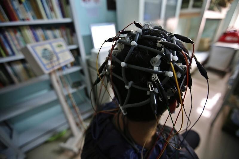 A boy who was addicted to the internet, has his brain scanned for research purposes at Daxing Internet Addiction Treatment Center in Beijing February 22, 2014. As growing numbers of young people in China immerse themselves in the cyber world, spending hours playing games online, worried parents are increasingly turning to boot camps to crush addiction. Military-style boot camps, designed to wean young people off their addiction to the internet, number as many as 250 in China alone. Picture taken February 22, 2014. REUTERS/Kim Kyung-Hoon (CHINA - Tags: SOCIETY)ATTENTION EDITORS - PICTURE 21 OF 33 FOR PACKAGE 'CURING CHINA'S INTERNET ADDICTS'TO FIND ALL IMAGES SEARCH 'INTERNET BOOT CAMP' - LM2EA6O18Z401