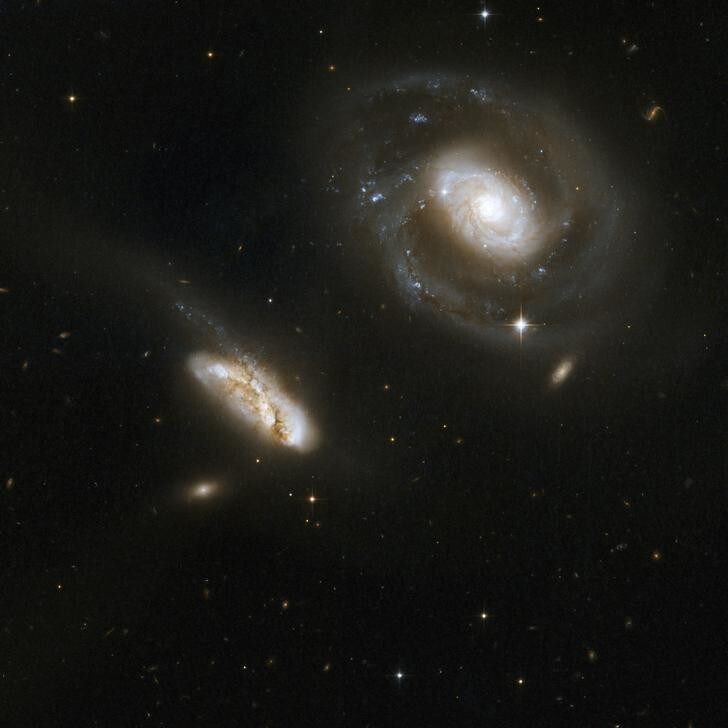 This is a stunning pair of interacting galaxies, the barred spiral Seyfert 1 galaxy NGC 7469 (Arp 298, Mrk 1514), a luminous infrared source with a powerful starburst deeply embedded into its circumnuclear region, and its smaller companion IC 5283.This system is located about 200 million light-years away from Earth in the constellation of Pegasus, the Winged Horse. This image is part of a large collection of 59 images of merging galaxies taken by the Hubble Space Telescope and released on the occasion of its 18th anniversary on April 24, 2008. REUTERS/NASA, ESA, the Hubble Heritage Team (STScI/AURA)-ESA/Hubble Collaboration, and A. Evans (University of Virginia, Charlottesville/NRAO/Stony Brook University)/Handout (UNITED STATES). FOR EDITORIAL USE ONLY. NOT FOR SALE FOR MARKETING OR ADVERTISING CAMPAIGNS.