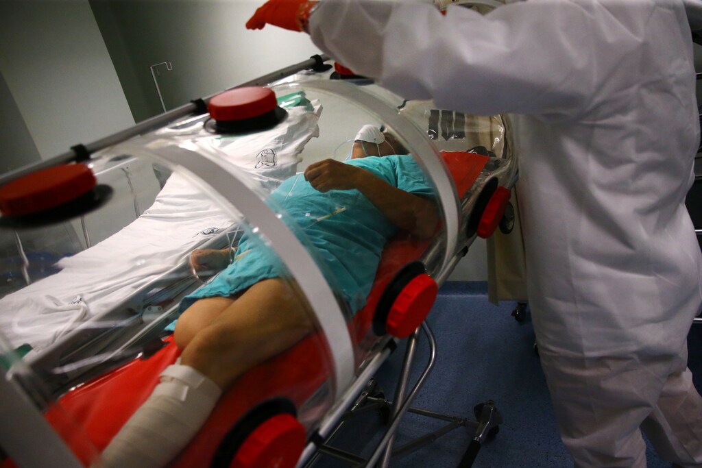 Luis, 62, a patient suffering from the coronavirus disease (COVID-19) and diabetes, is pictured inside a capsule as Red Cross paramedics prepare to transfer him from a hospital to another in Mexico City, Mexico, June 8, 2020.
