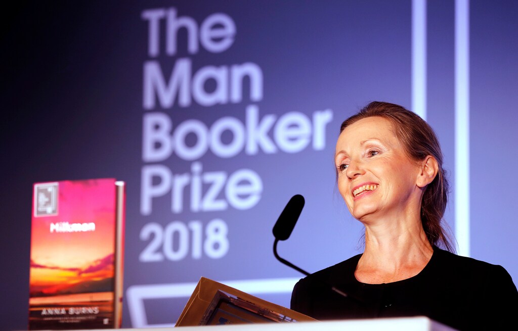 Writer Anna Burns smiles after she was presented with the Man Booker Prize for Fiction 2018 by Britain's Camilla, the Duchess of Cornwall during the prize's 50th year at the Guildhall in London, Britain, October 16, 2018. Frank Augstein/Pool via REUTERS - RC191684CD00