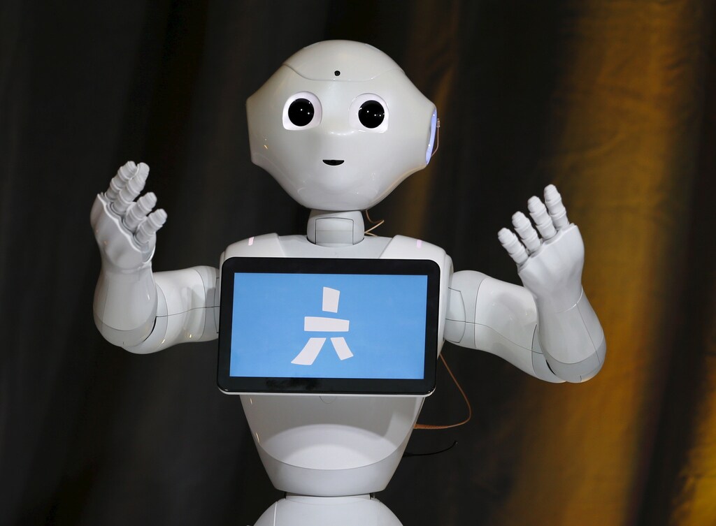 Pepper, an emotional Robot, greets conference attendees during the Wall Street Journal Digital Live (WSJDLive) conference at the Montage hotel in Laguna Beach, California October 20, 2015. REUTERS/Mike Blake - GF20000025613