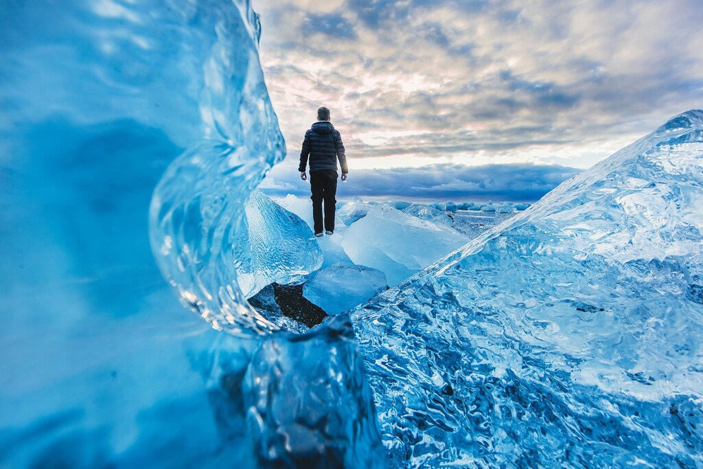 Man walking across ice.