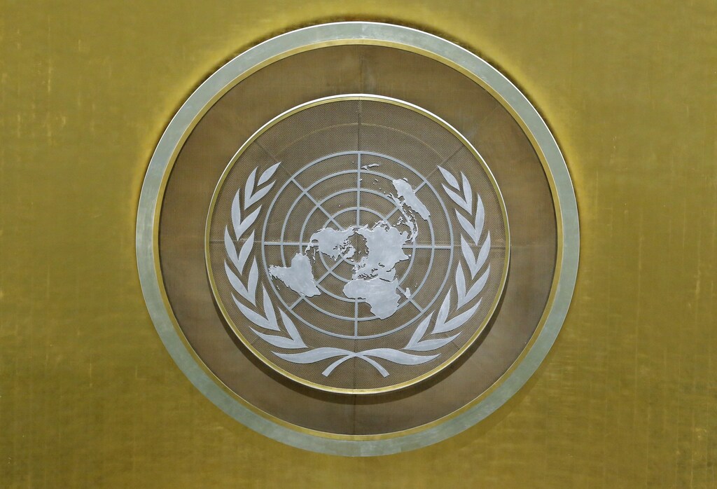 The United Nations emblem is seen in the UN General Assembly hall during United Nations General Assembly. REUTERS/Lucas Jackson - HP1ED9M1AJXGO