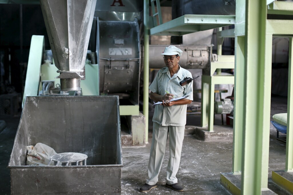Thongdee Saenghow, a 62-year-old production supervisor, works at a rice vermicelli factory outside Bangkok, Thailand, February 5, 2016. The World Bank estimates the working-age population will shrink by 11 percent by 2040, the fastest contraction among Southeast Asia's developing countries. Thailand's stage of economic development, the rising cost of living and education, and a population waiting longer to get married are among the reasons it is ageing more quickly than its neighbours. An effective contraception programme in the 1970s also played a part, said Sutayut Osornprasop, a human development specialist at the World Bank in Thailand. Picture taken February 5, 2016. REUTERS/Jorge Silva - RTX269TE