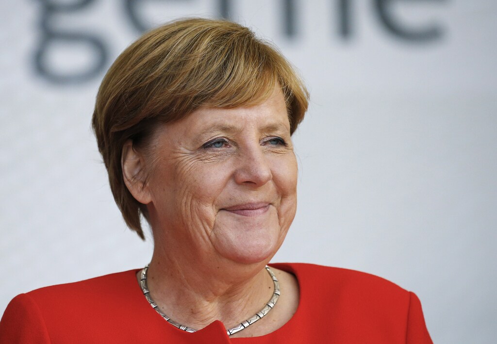 German Chancellor Angela Merkel, a top candidate of the Christian Democratic Union Party (CDU), attends an election rally ahead of the upcoming federal election in Sankt Peter-Ording, Germany, August 21, 2017. REUTERS/Morris Mac Matzen - RTS1COLD