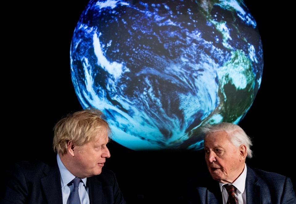 British Prime Minister Boris Johnson and David Attenborough speak with school children during a conference about the COP26 UN Climate Summit, at the Science Museum in London, Britain February 4, 2020.