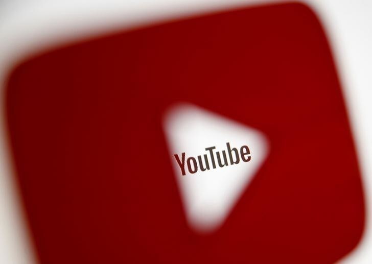 A 3D-printed YouTube icon is seen in front of a displayed YouTube logo in this illustration taken October 25, 2017. REUTERS/Dado Ruvic/Ilustration
