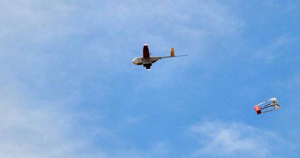 A drone drops its first blood delivery in the compound of Kabgayi hospital south of Rwanda capital Kigali where Zipline, a California-based robotics company delivered their first blood to patients using a drone October 13, 2016. Picture taken October 13, 2016