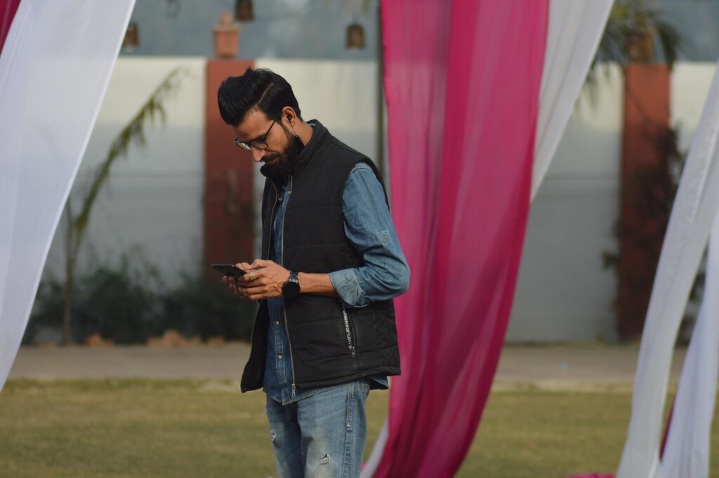 A man in Bijnor, Uttar Pradesh, India, viewing his mobile phone.