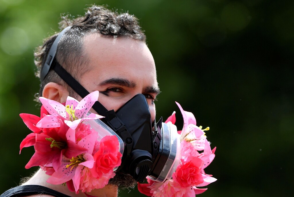 A participant wears a decorated face mask during a Black Trans Lives Matter rally in London, Britain, June 27, 2020. REUTERS/Toby Melville TPX IMAGES OF THE DAY - RC2PHH9WM0LY