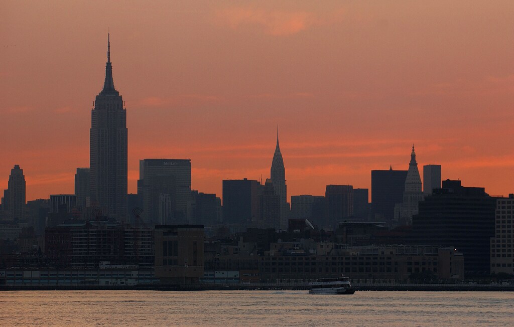 New York City skyline is seen at sunrise during a power outage August 15,2003. More than 12 hours after the biggest North American power outage inhistory left huge swaths of the Northeast in sweltering darkness, much ofNew York and its suburbs were still without electricity. The subways werenot running and many residents had no water because their electric pumpswere not working. REUTERS/Chip East Pictures of the Year 2003 cmePOWER OUTAGES - RP4DRHYLJVAB