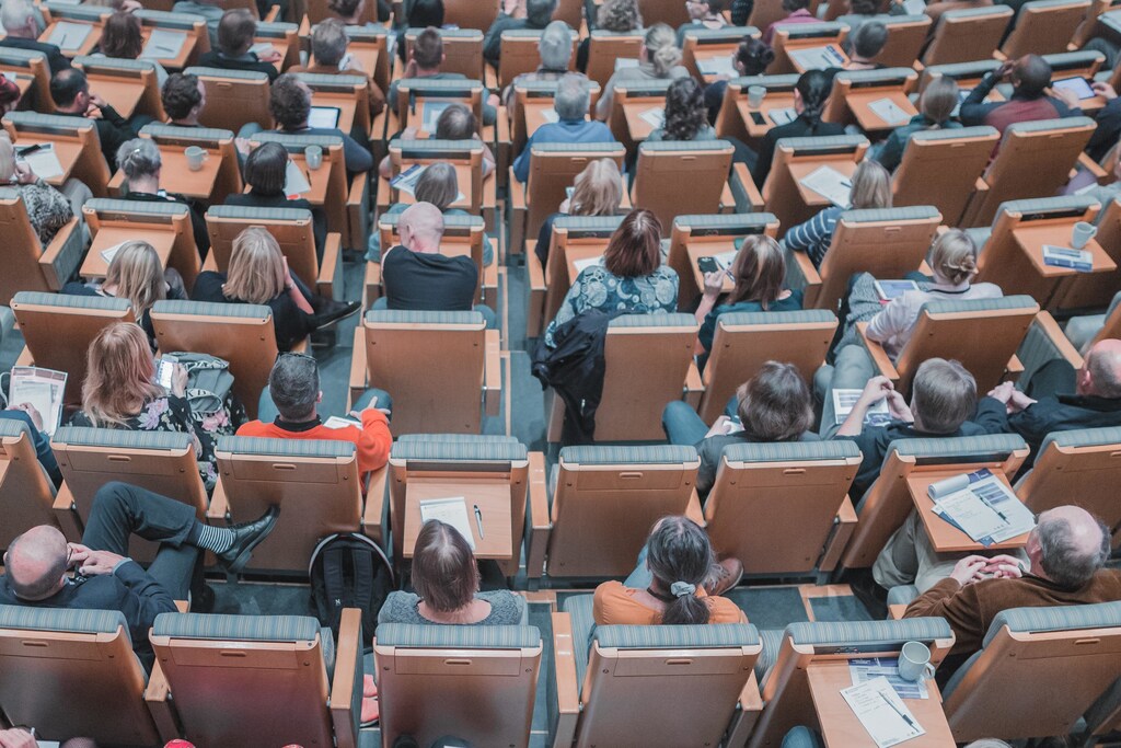 University lecture hall with seated students.