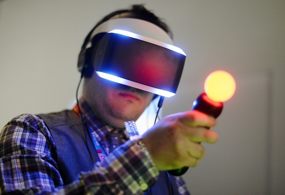 An attendee tries out Sony's Morpheus virtual reality headset at the 2014 Electronic Entertainment Expo, known as E3, in Los Angeles, California June 10, 2014. There has been a rising interest in virtual reality platforms among publishers and developers, who hope the years-old technology -- which creates a 360-degree view that immerses players in fantasy settings -- can finally become a viable platform to reverse shrinking video game industry revenues and draw a new generation of users. Picture taken June 10.