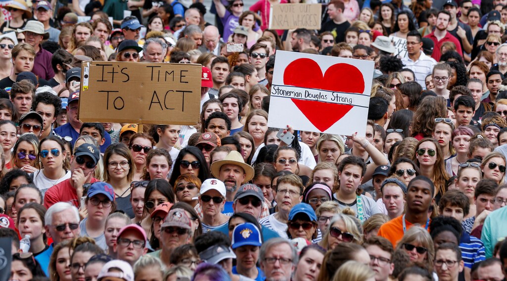 Protestors rally outside the Capitol urging Florida lawmakers to reform gun laws, in the wake of last week's mass shooting at Marjory Stoneman Douglas High School, in Tallahassee, Florida, U.S., February 21, 2018. REUTERS/Colin Hackley - RC1A5EAE9000