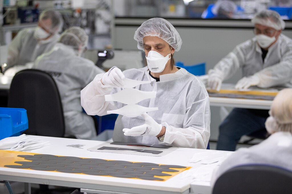 Employees of textile company Zender Germany GmbH, usually an automotive supplier, make protective masks in Osnabrueck, Germany, April 6, 2020, as the spread of the coronavirus disease (COVID-19) continues. Friso Gentsch/Pool via REUTERS - RC20ZF9Z2HBC