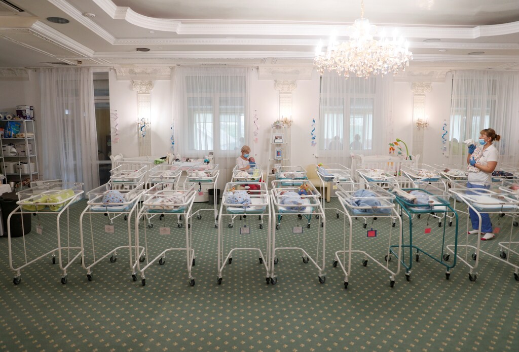 A view shows nurses and newborns in the Hotel Venice owned by BioTexCom clinic in Kiev, Ukraine May 14, 2020. At least fifty babies born to surrogate mothers are stranded in a Ukrainian clinic as the coronavirus disease (COVID-19) lockdown prevents their foreign parents from collecting them. Picture taken May 14, 2020. REUTERS/Gleb Garanich TPX IMAGES OF THE DAY - RC2KOG9O3GQM