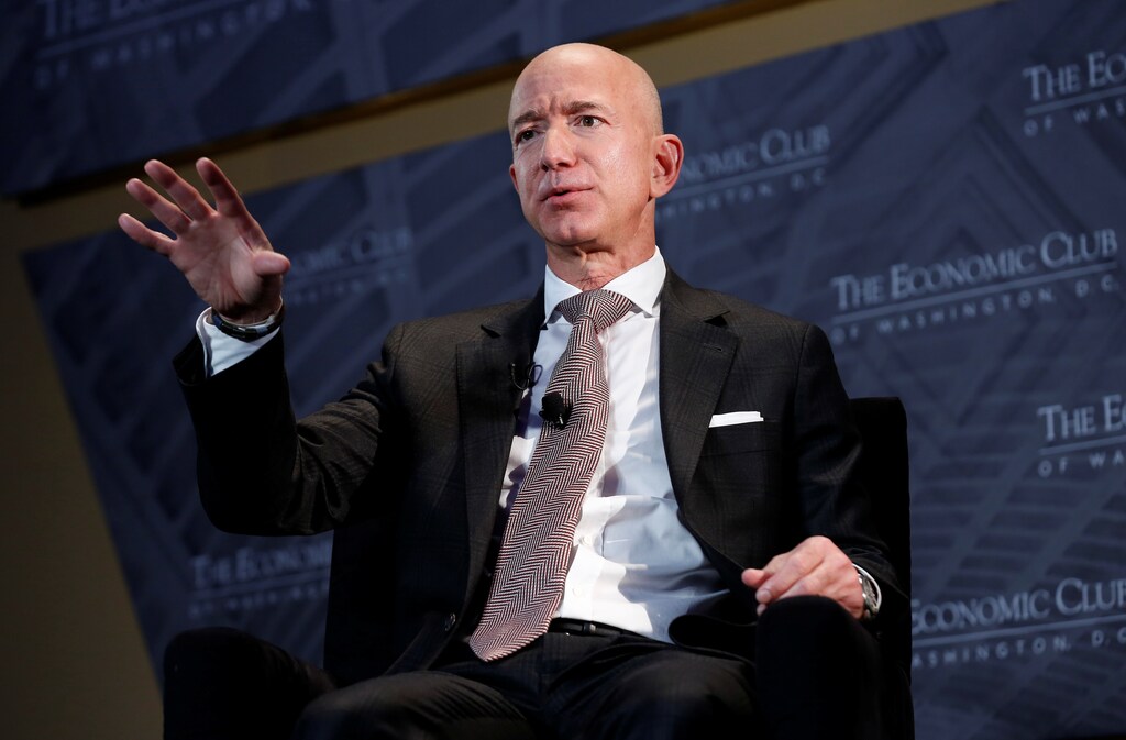 Jeff Bezos, president and CEO of Amazon and owner of The Washington Post, speaks at the Economic Club of Washington DC's "Milestone Celebration Dinner" in Washington, U.S., September 13, 2018. REUTERS/Joshua Roberts - RC1E8F0B3400