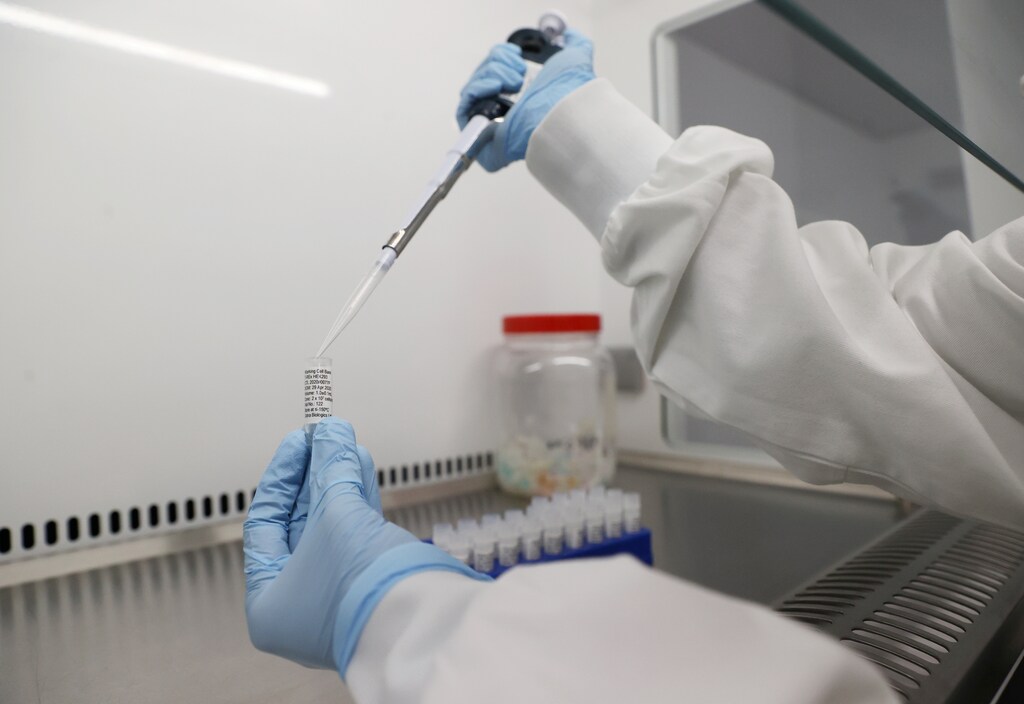 Scientists are seen working at Cobra Biologics, they are working on a potential vaccine for COVID-19, following the outbreak of the coronavirus disease (COVID-19), in Keele, Britain, April 30, 2020. REUTERS/Carl Recine - RC2ZEG96INIW