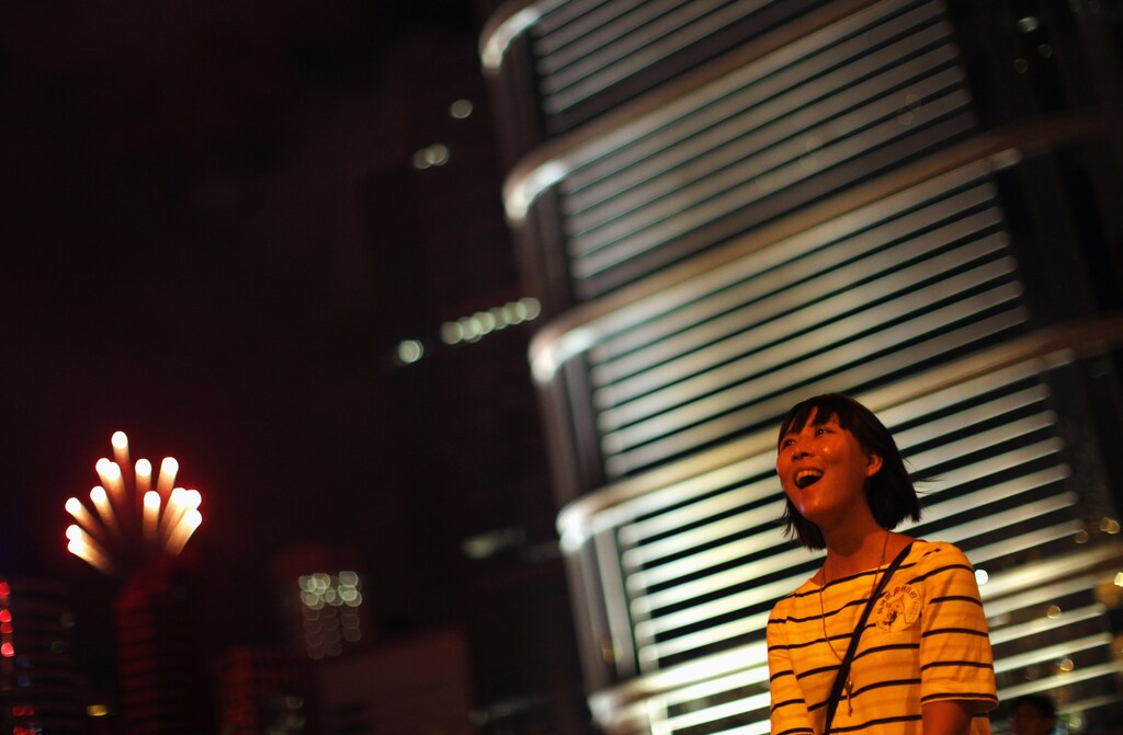 A pro-democracy demonstrator reacts during a fireworks display in downtown Hong Kong July 1, 2012, during the 15th anniversary of the territory's handover to China. New Hong Kong leader Leung Chun-ying was sworn into office on Sunday by Chinese President Hu for a five-year term in which he will confront challenges ranging from human rights to democracy after a tumultuous year of transition and protest. REUTERS/Carlos Barria (CHINA - Tags: POLITICS CIVIL UNREST TPX IMAGES OF THE DAY) - GM1E8711LRL01