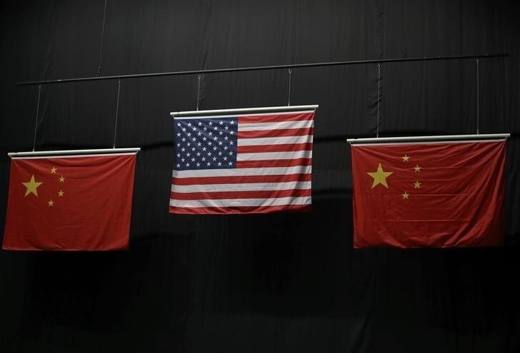 Aug 6, 2016; Rio de Janeiro, Brazil; The American flag flies above the Chinese flags after Virginia Thrasher took the gold medal in the 10m air rifle competition at Olympic Shooting Centre. Mandatory Credit: Geoff Burke-USA TODAY Sports Picture Supplied by Action Images