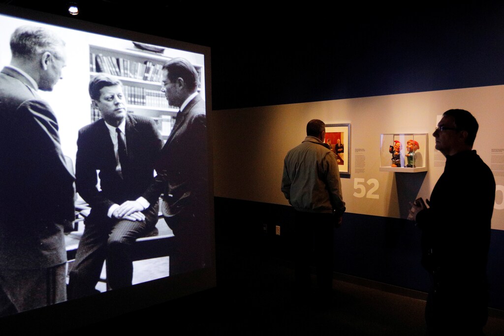 A visitor looks at a projected image of President John F. Kennedy in the "JFK 100" exhibit, on the 100th anniversary of his birth on May 29, 1917, at the John F. Kennedy Presidential Library in Boston, Massachusetts, U.S., May 29, 2017. REUTERS/Brian Snyder - RTX384DL