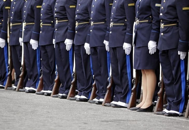 Police officers participate in a parade during the celebration of the 183rd anniversary of the Uruguayan Police Force in downtown Montevideo, December 18, 2012. REUTERS/Andres Stapff (URUGUAY - Tags: ANNIVERSARY CRIME LAW)