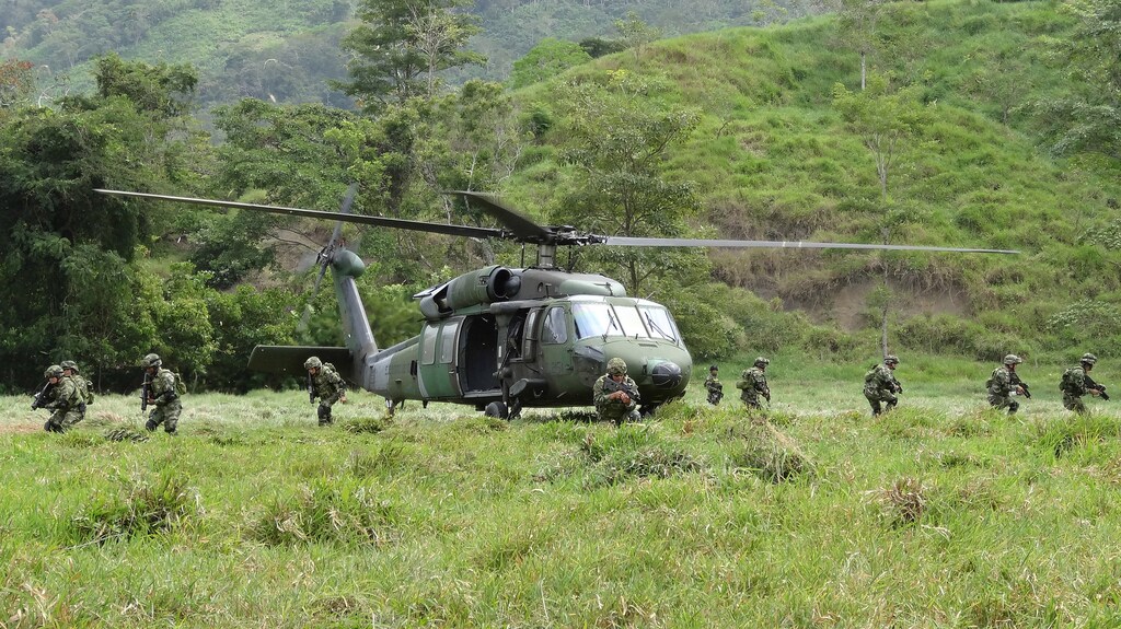 Soldiers of the Colombian army disembark from a helicopter in a zone previously occupied by FARC rebels, in Saiza, Colombia February 3, 2017. Picture taken February 3, 2017. REUTERS/Luis Jaime Acosta - RTX2ZP5Z