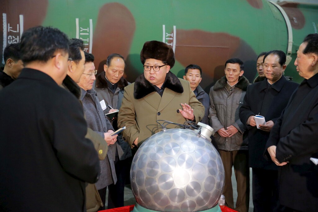 FILE PHOTO: North Korean leader Kim Jong Un meets scientists and technicians in the field of researches into nuclear weapons in this undated photo released by North Korea's Korean Central News Agency (KCNA) in Pyongyang March 9, 2016. REUTERS/KCNA/File Photo ATTENTION EDITORS - THIS PICTURE WAS PROVIDED BY A THIRD PARTY. REUTERS IS UNABLE TO INDEPENDENTLY VERIFY THE AUTHENTICITY, CONTENT, LOCATION OR DATE OF THIS IMAGE. FOR EDITORIAL USE ONLY. NOT FOR SALE FOR MARKETING OR ADVERTISING CAMPAIGNS. THIS PICTURE IS DISTRIBUTED EXACTLY AS RECEIVED BY REUTERS, AS A SERVICE TO CLIENTS. NO THIRD PARTY SALES. SOUTH KOREA OUT. NO COMMERCIAL OR EDITORIAL SALES IN SOUTH KOREA - RTS1CUVB