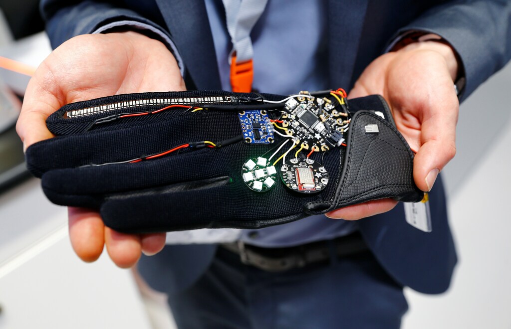 A glove with sensors transmitting the hand's movement to a Kuka robotic arm is pictured at the stand of German industrial robot maker Kuka during the Hannover Fair in Hanover, Germany, April 25, 2016. REUTERS/Wolfgang Rattay - RTX2FH7T