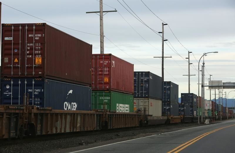 Shipping containers are unloaded at Roberts Bank Superport in Delta, British Columbia, Canada January 15, 2018. Picture taken January 15, 2018. REUTERS/Ben Nelms - RC1606EFDA10