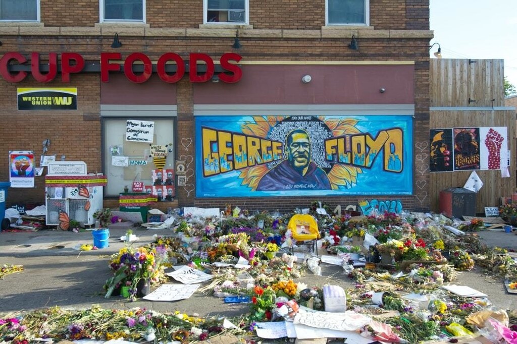 image of flowers left by a George Floyd memorial
