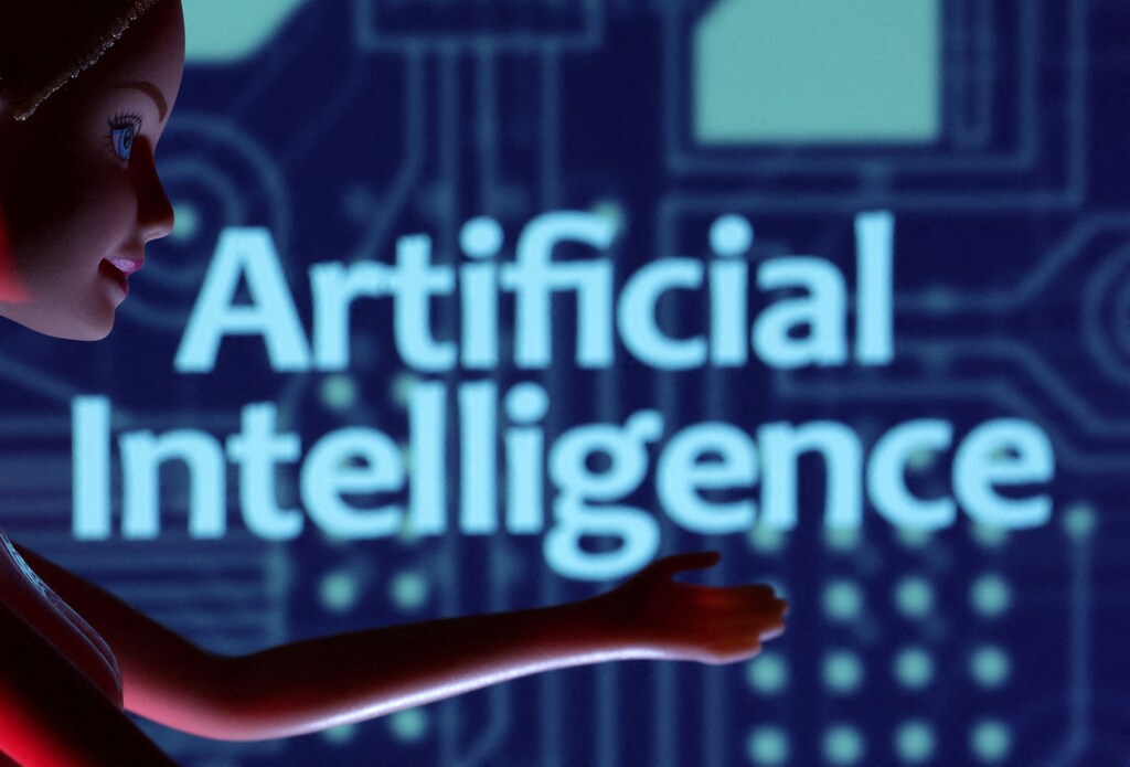 The words artificial intelligence are pictured on a screen.