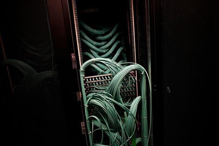 Cables and computers are seen inside a data centre at an office in the heart of the financial district in London, Britain May 15, 2017. REUTERS/Dylan Martinez