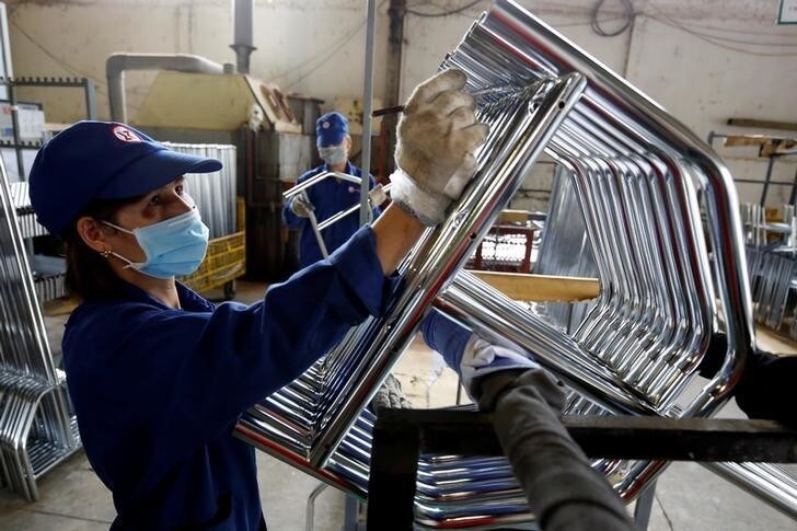 Women work at Xuan Hoa furniture factory in Xuan Hoa town, outside Hanoi, Vietnam April 5, 2018.