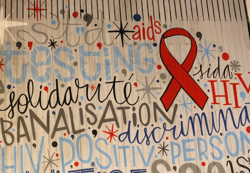 A giant painting with the image of a red ribbon is seen in central Brussels, ahead of World AIDS Day, November 29, 2013. World AIDS Day is observed annually on December 1. REUTERS/Yves Herman (BELGIUM - Tags: HEALTH SOCIETY) - GM1E9BU087G01