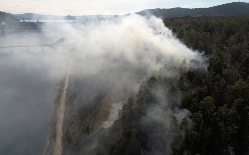 An aerial view shows a forest fire in the Siberian Taiga area on the bank of the Yenisei River near the Krasnoyarsk hydro electric power station outside Krasnoyarsk, Russia May 3, 2018.