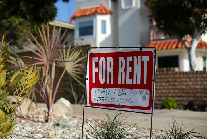 A "For Rent" sign is posted outside a small apartment complex in Carlsbad, California, U.S., January 18, 2017. REUTERS/Mike Blake