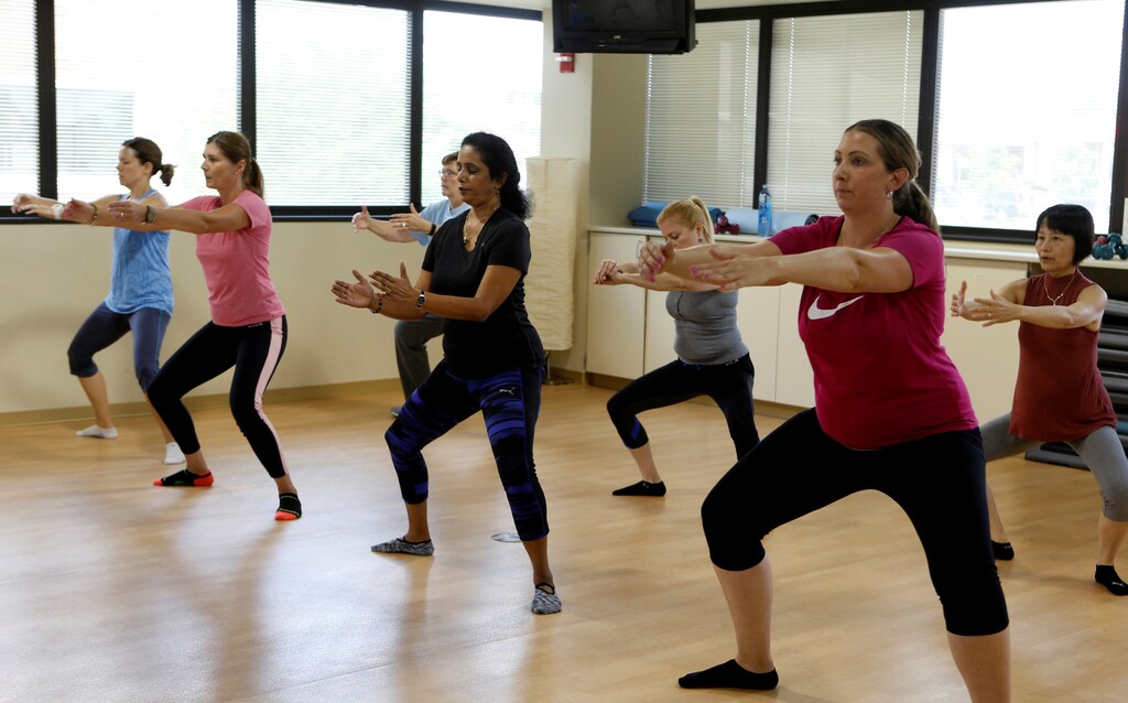 Dr. Anu Puttagunta, endocrinologist (2nd R), participates with hospital staff in a MOVE exercise class at Saint Joseph Mercy hospital in Ypsilanti, Michigan, U.S., August 23, 2017. Picture taken August 23, 2017. REUTERS/Rebecca Cook - RC1B6027A800