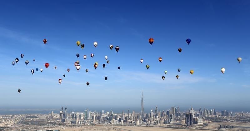 Hot air balloons fly over Dubai during the World Air Games 2015, held under the rules of the Federation Aeronautique Internationale (FAI) as part of the "Dubai International Balloon Fiesta" event, United Arab Emirates December 9, 2015. REUTERS/Karim Sahib/Pool TPX IMAGES OF THE DAY - D1AESAHSQCAA