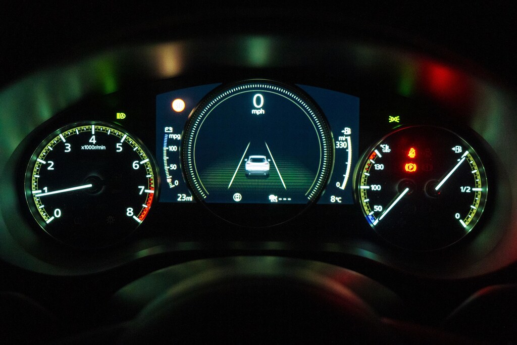 An illuminated car dashboard.