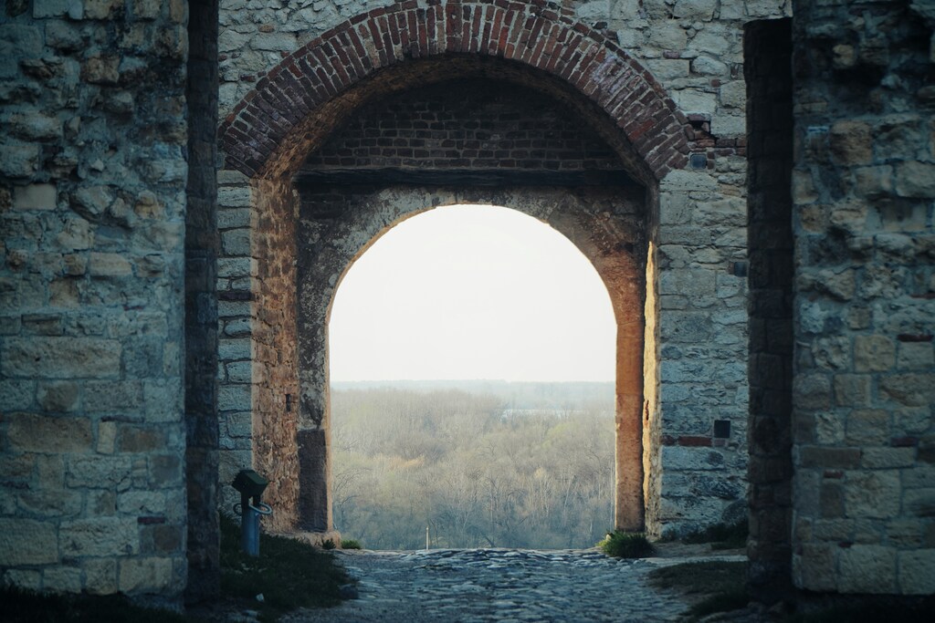 A stone archway: The global economy is entering a new, more uncertain phase