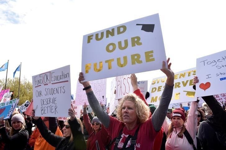 Teachers rally outside the state Capitol on the second day of a teacher walkout to demand higher pay and more funding for education in Oklahoma City, Oklahoma, U.S., April 3, 2018