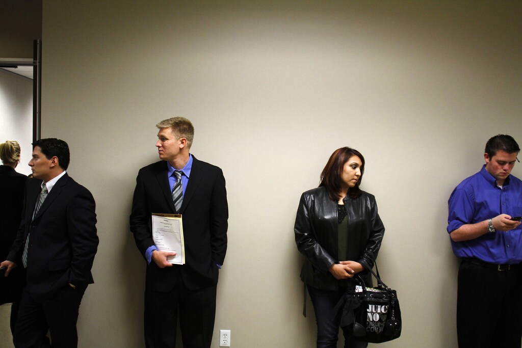 People wait to be interviewed during the Chase Bank Veterans Day job fair in Phoenix, Arizona November 11, 2011. Chase Bank plans on hiring over 300 new hires, including veterans, for their open positions, according to local media. REUTERS/Joshua Lott (UNITED STATES - Tags: BUSINESS EMPLOYMENT SOCIETY) - RTR2TWHI