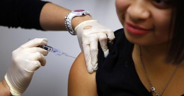 Jasmine Rodriguez, 10, gets an influenza vaccine at Boston Children’s Hospital in Boston, Massachusetts January 10, 2013.