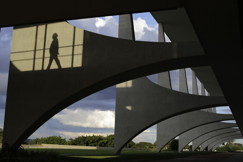 A view shows the Planalto Palace designed by architect Oscar Niemeyer in Brasilia April 2, 2014. The futuristic capital city built from scratch on savannah ranch land in the middle of nowhere was meant to open up the interior of Brazil and symbolize its rise as an economic power. Fifty-five years later, Brasilia's modern buildings designed by famed architect Oscar Niemeyer and laid out by urban planner Lucio Costa are still imposing, an open-air museum on UNESCO's World Heritage list. Brasilia will host seven games during the 2014 World Cup soccer tournament. Picture taken April 2, 2014. To match TRAVEL-BRASILIA/ REUTERS/Ueslei Marcelino (BRAZIL - Tags: SPORT SOCCER TRAVEL TPX IMAGES OF THE DAY CITYSCAPE) - RTR3NGQP