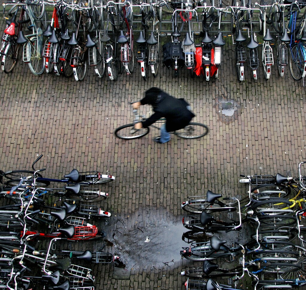 A man rides his bike in a bicycle shed near Central Station Amsterdam January 17, 2007.