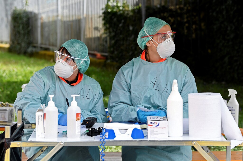 Medical personnel wearing protective face masks are seen at Spedali Civili hospital in Brescia, Italy March 13, Coronavirus china virus health healthcare who world health organization disease deaths pandemic epidemic worries concerns Health virus contagious contagion viruses diseases disease lab laboratory doctor health dr nurse medical medicine drugs vaccines vaccinations inoculations technology testing test medicinal biotechnology biotech biology chemistry physics microscope research influenza flu cold common cold bug risk symptomes respiratory china iran italy europe asia america south america north washing hands wash hands coughs sneezes spread spreading precaution precautions health warning covid 19 cov SARS 2019ncov wuhan sarscow wuhanpneumonia pneumonia outbreak patients unhealthy fatality mortality elderly old elder age serious death deathly deadly